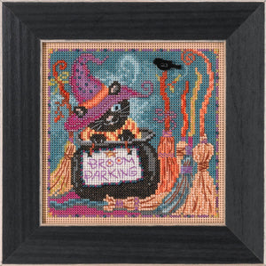 Mill Hill Beaded picture kit. This kit features a back cat inside a witches cauldron with broomsticks all around. 