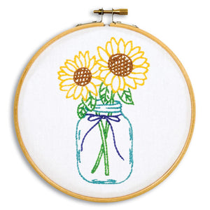 Stamped embroidery hoop kit. This design features 2 sunflowers in a mason jar. 