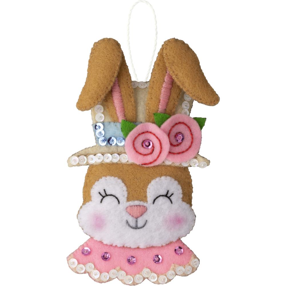 Easter bunny head with pink collar and flowers.