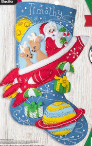 Bucilla felt christmas stocking kit. Design features Santa  and 2 deer in a red rocket ship while dropping gifts.