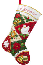 Load image into Gallery viewer, Bucilla felt christmas stocking kit. Design features a red, green, and cream patchwork pattern with bells, a dove, and poinsettia.