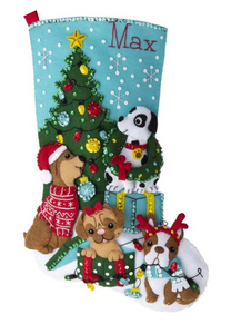 Bucilla Christmas felt stocking kit. Design features four dogs decorating a christmas tree and playing with decorations. 