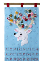 Load image into Gallery viewer, Bucilla felt wall hanging kit. Design features a reindeer with large antlers that hold the twenty-four ornaments. Below the deer, there are twenty-four pockets.