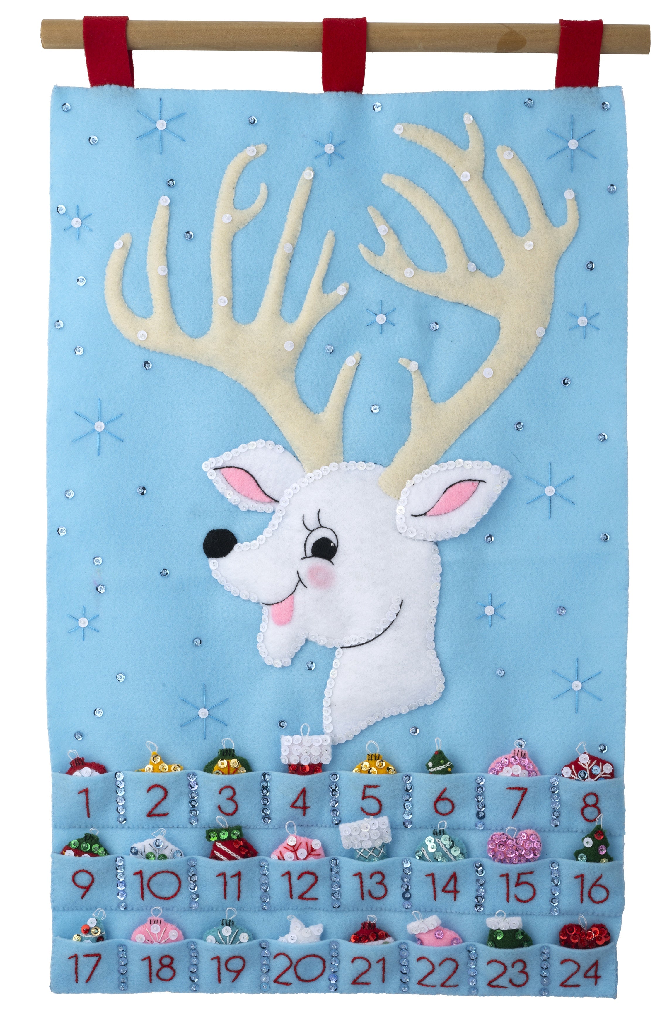 Bucilla felt wall hanging kit. Design features a reindeer with large antlers that hold the twenty-four ornaments. Below the deer, there are twenty-four pockets.