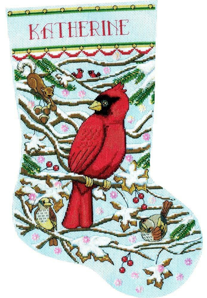 Design works counted cross stitch stocking kit. Design features a cardinal sitting on a snowy tree branch with other animals in the tree. 