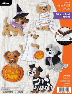 Bucilla felt ornament kit. Design features 6 dogs dressed in halloween costumes.