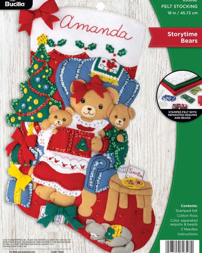 Bucilla felt christmas stocking kit. Design features a Mama bear reading a story to her two baby cubs. the background is a living room setting.