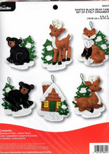 Load image into Gallery viewer, DIY Bucilla Santas Black Bear Cabin Christmas Holiday Felt Ornament Kit 86947E