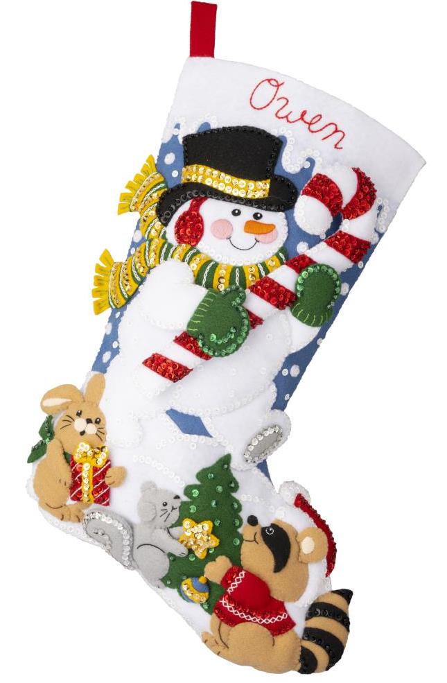Bucilla felt stocking kit. Design features a snowman holding a large candy cane. A raccoon, squirrel, and bunny in the background.