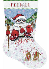 Counted cross stitch christmas stocking kit. The design features Santa  skiing through the snow. Reindeer in the background. 