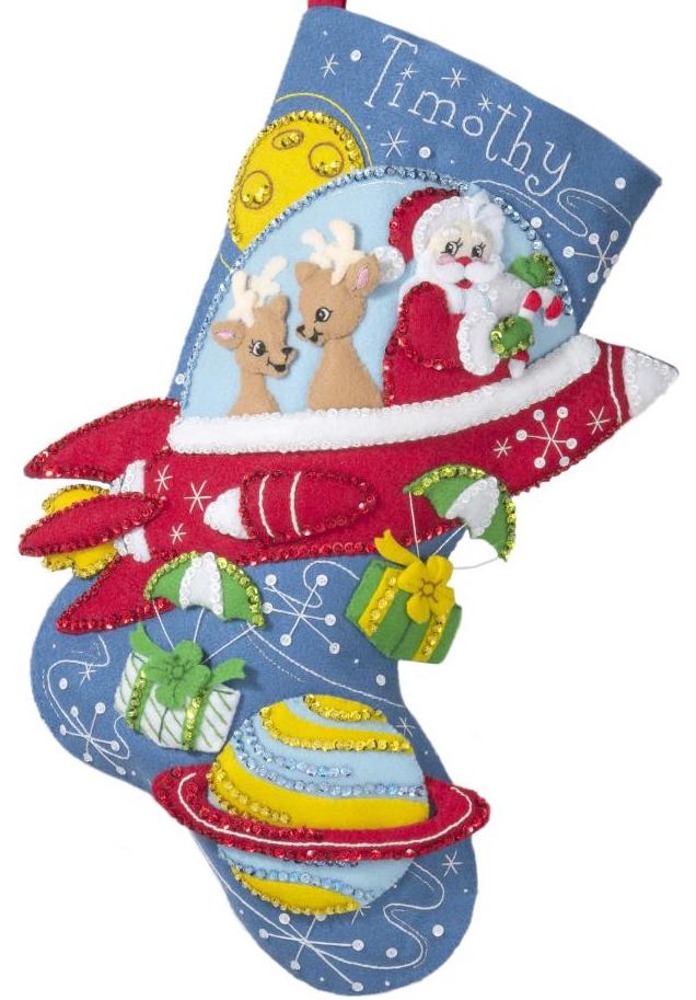 Bucilla felt christmas stocking kit. Design features Santa and 2 deer in a red rocket ship while dropping gifts.