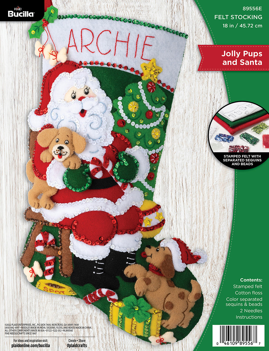 Bucilla felt christmas stocking kit. Design features santa sitting a chair holding a puppy while another puppy runs up to his knees. 