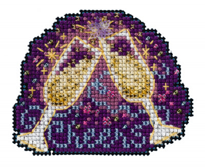 Mill Hill counted cross stitch kit. Design features two champagne glasses with a dark purple sparkly background.