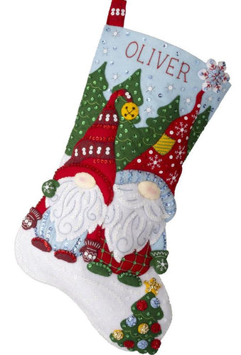 Bucilla felt stocking kit. Design features to gnomes in  Red and green  standing outside chillin.