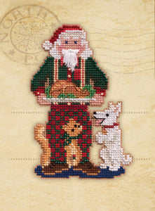 Mill Hill counted cross stitch kit. Design features Santa carrying a Turkey Dinner with a cat and dog  at his feet.