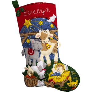 Bucilla felt christmas stocking kit. Design features the baby Jesus surrounded by baby animals in a manger. 