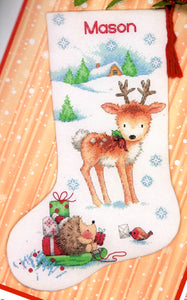 Dimensions counted cross stitch stocking kit. Design features a reindeer with a hedgehog on a sled with gifts. 