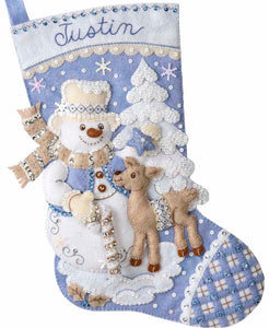 Bucilla felt christmas stocking kit. Design features a snowman and deer.  The colors in this stocking are blue and white and tan. 
