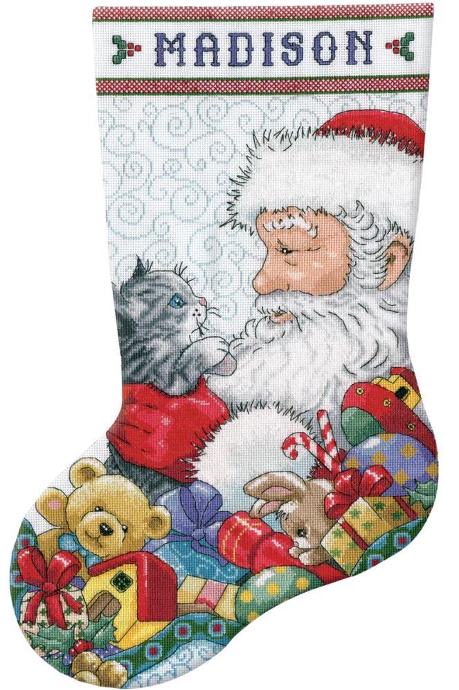 Counted Cross stitch christmas stocking kit. the design is santa holding a gray and white kitten. Toys intthe background. 