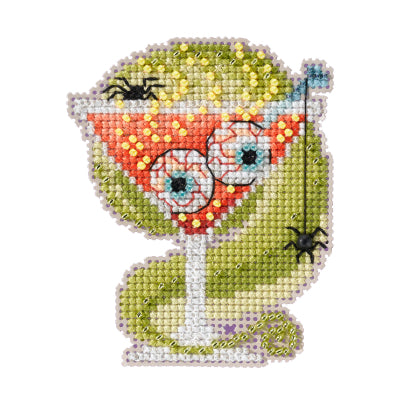 Mill Hill counted cross stitch ornament kit. Design features a martini with two eyeballs. Spiders and green goo in the background.