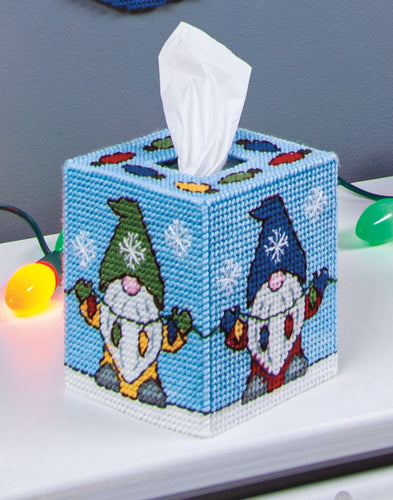 Plastic Canvas Tissue Box Cover Kit. This Design features colorful christmas gnomes holding christmas lights. 