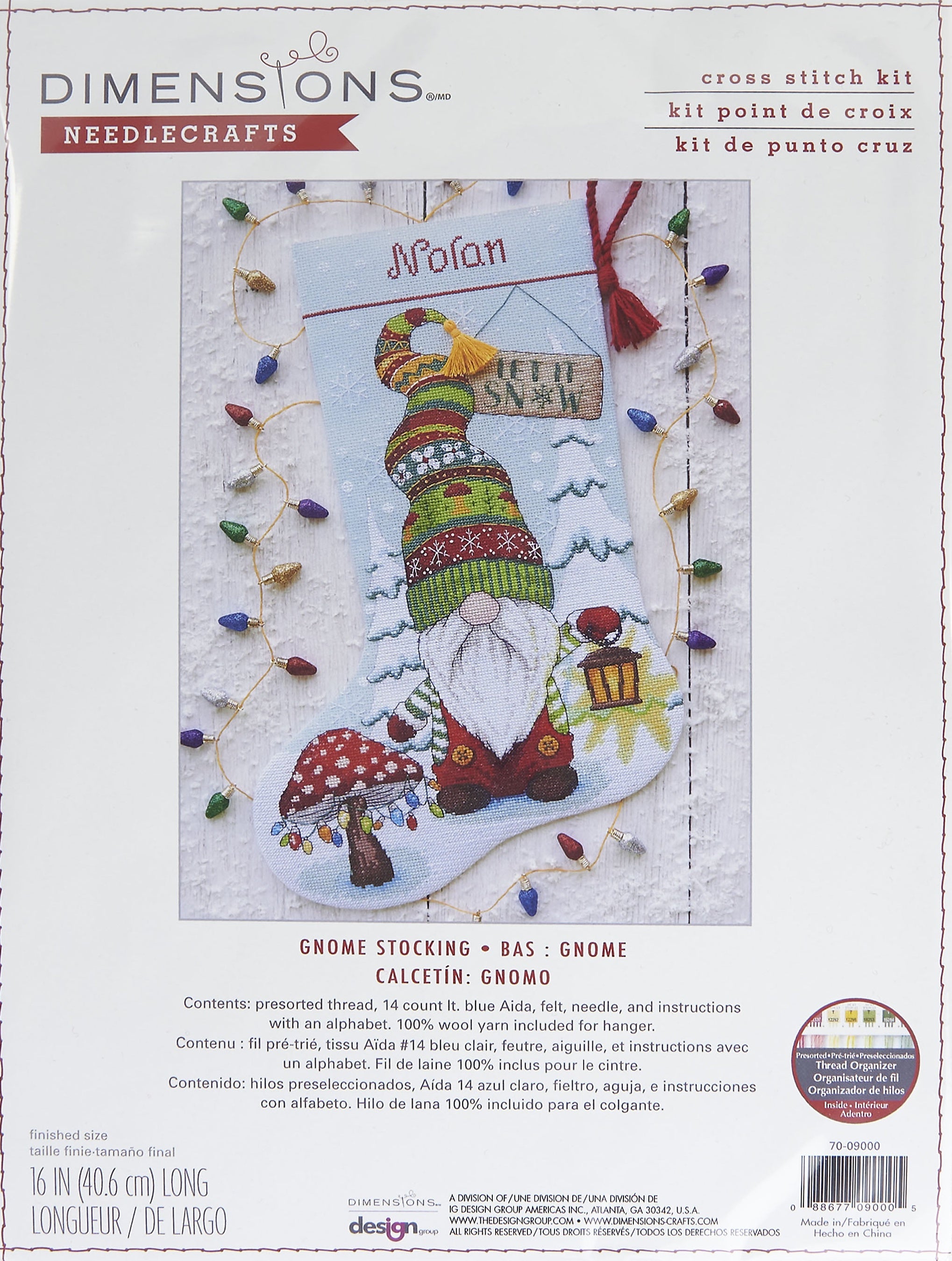 Dimensions counted cross stitch stocking kit. Design features a gnome with a lantern and a mushroom tree with lights.  Edit alt text