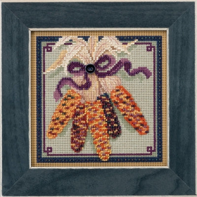 Mill Hill counted cross stitch kit. Design features a group of colored harvest corn.