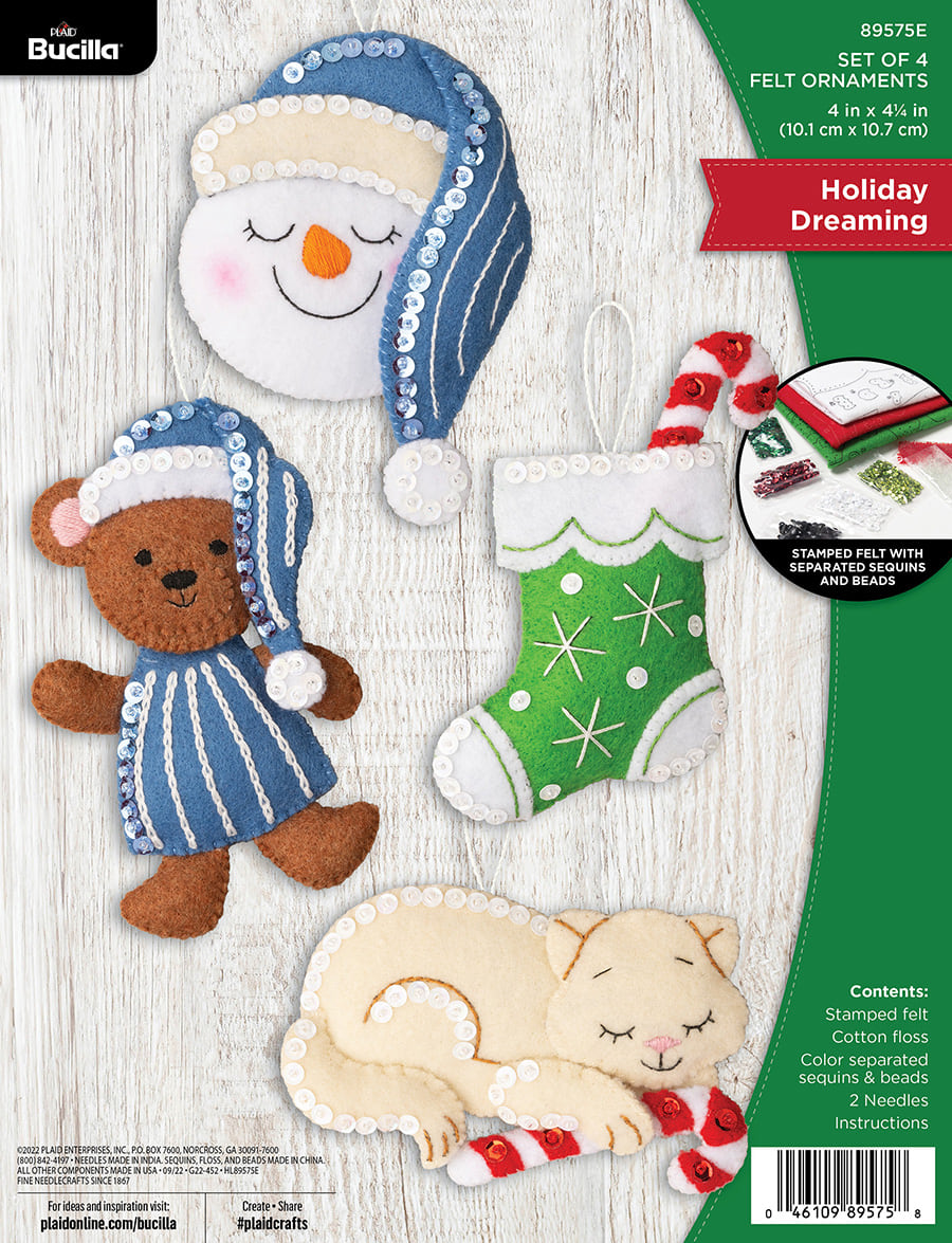 Bucilla felt ornament kit. Design features four ornaments. A cat with candy cane. S sleeping snowman. a stocking with candy cane. and a teddy bear in pajamas.