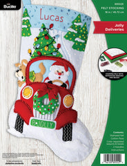 Bucilla felt stocking kit. Design features Santa and Puppy making Christmas tree deliveries in  an old red truck.