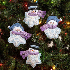 Bucilla Felt Christmas ornament kit. Design features snowman heads on top of blue and white snowflakes.