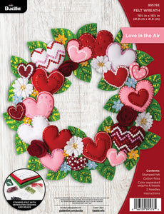 Bucilla felt wreath kit. Design features red, pink and white hearts mixed with blue and white flowers.