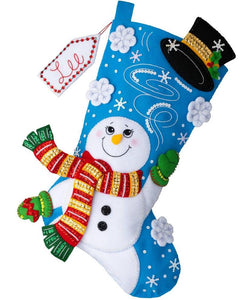 Bucilla felt stocking kit. Design features a snowman throwing his hat up in to the air releasing his magic. 