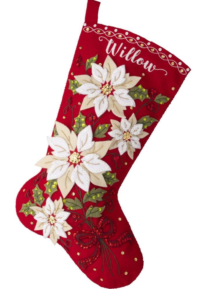 Bucilla felt stocking kit. Design features elegant white poinsettias with green leaves and a deep red background. 