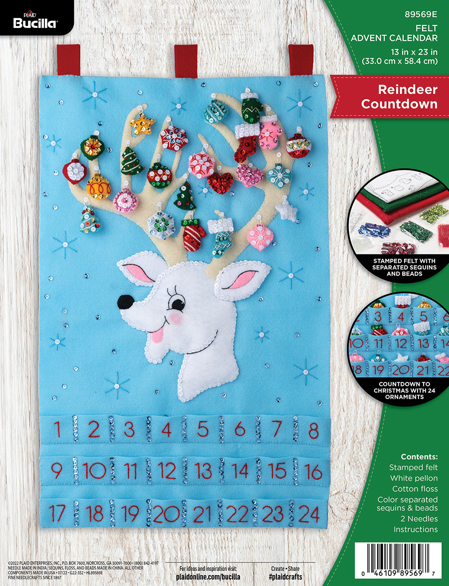 Bucilla felt wall hanging kit. Design features a reindeer with large antlers that hold the twenty-four  ornaments.  Below the deer, there are twenty-four pockets.