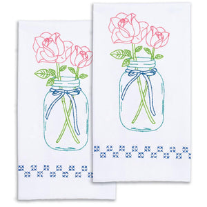 Decorative stamped for crosss stitch and embroidery. This design features 2 pink roses in a mason jar.
