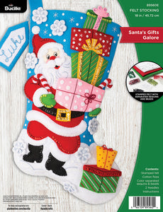 Bucilla felt stocking kit. Design features santa carrying a handful of gifts on a snowy day.