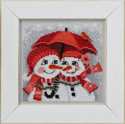 Mill Hill Beaded  counted cross stitch kit. The design features two snowmen with red scarves and hats under a  red umbrella.