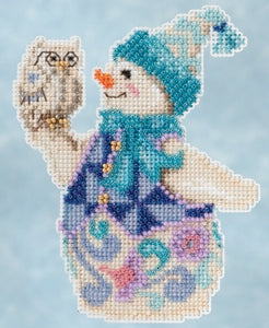 Mill Hill Beaded  counted cross stitch kit. The design features a snowman in a colorful blue and purple outfit holding an owl.