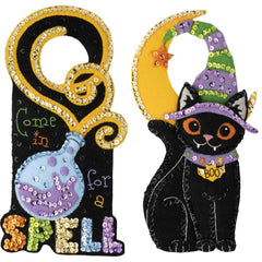 Bucilla felt door hanger kit. Design features a potion bottle on one and a black cat on the other.