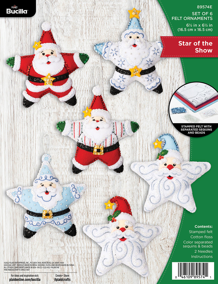 Bucilla felt ornament kit. Design features six star shaped ornaments. Two santa face ornaments. Two red and green santa ornaments. Two blue and white santa ornaments.