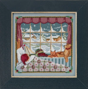 Mill Hill counted cross stitch kit. Design features Children nestled in bed infant of a snowy window.