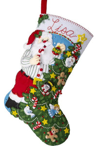 Bucilla felt stocking kit. Design features Santa in his casual clothes decorating his Christmas Tree. 