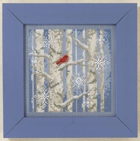 Mill Hill Beaded  counted cross stitch kit. The design features a red cardinal in a forest of white trees and blue background.